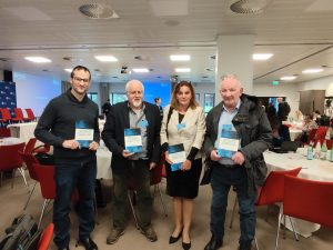 4 out of the 7 authors of the book with a copy of it during the NEA-OECD stakeholder involvement workshop in Paris (October 2025).